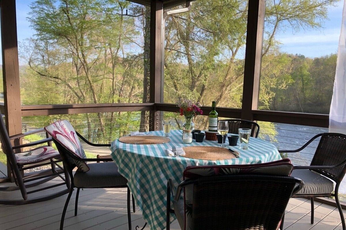 Screened in dining porch off the kitchen and living room. Dining at its best!