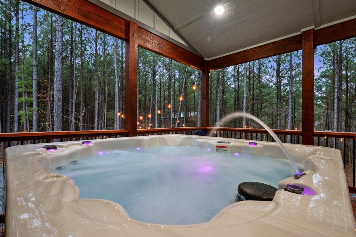 With bubbling water and forest views all around, the hot tub quickly becomes one of the most relaxing spots on the property.