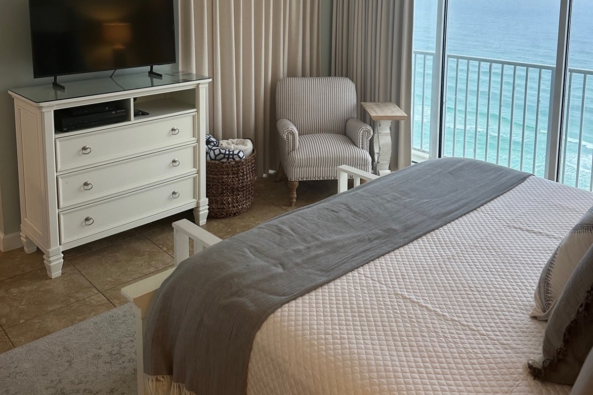 Master bedroom with king bed and beach view and smart TV