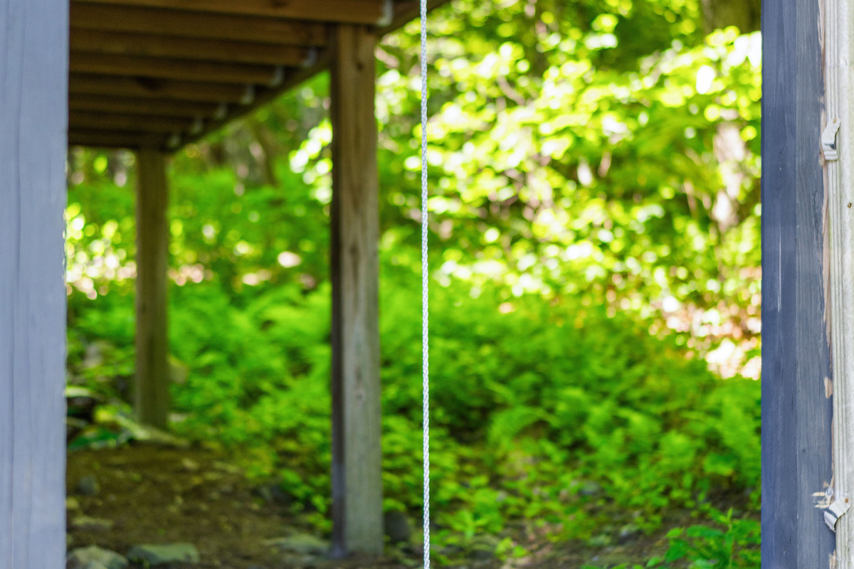 Simple disc swing under the porch—easy, classic fun for kids