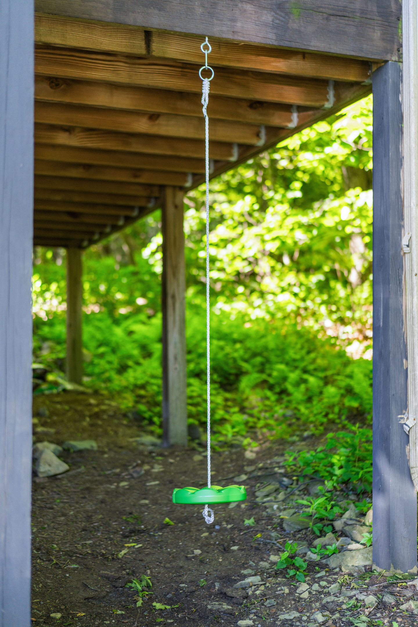 Simple disc swing under the porch—easy, classic fun for kids