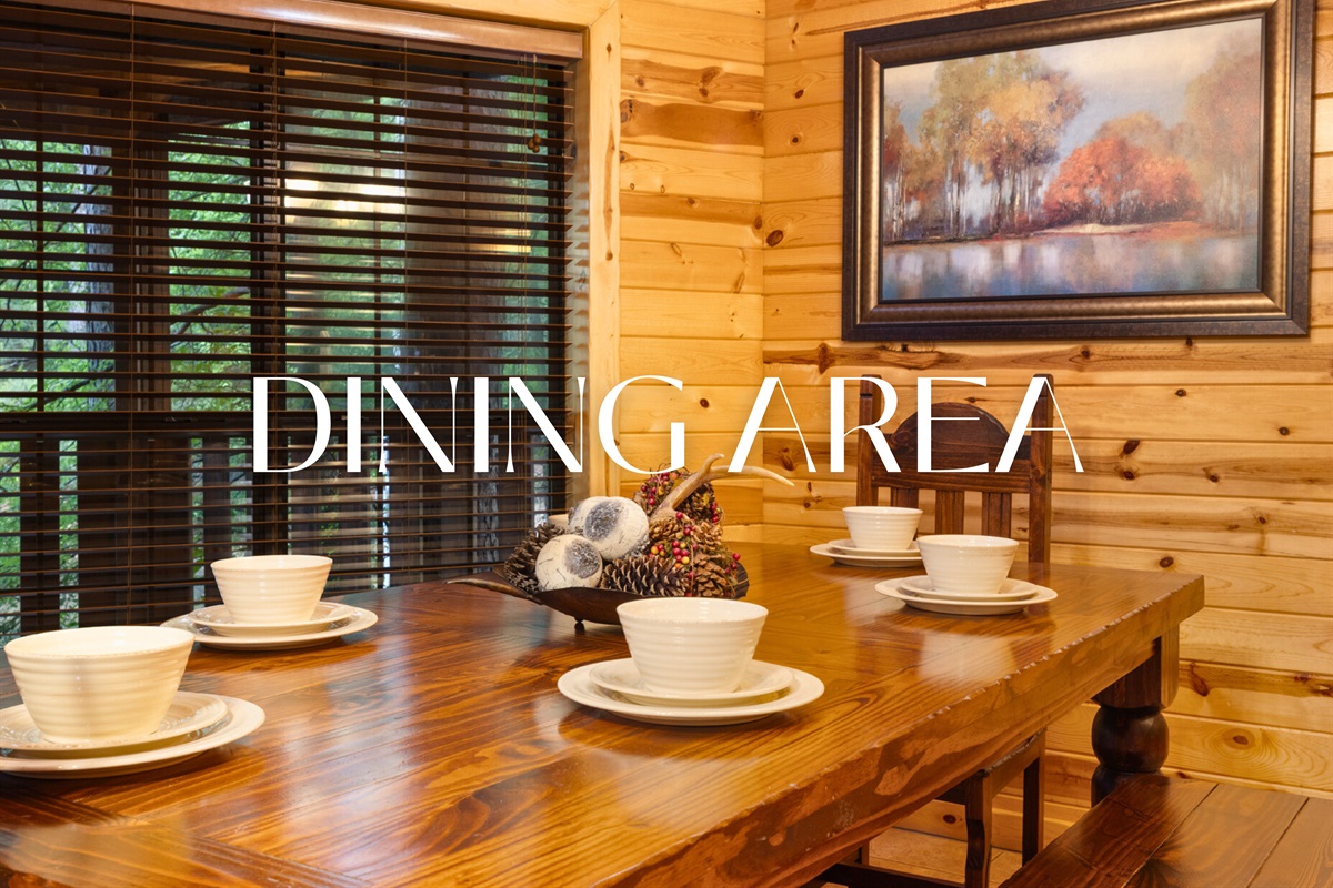 Dining area with rustic wood table and cabin charm.
