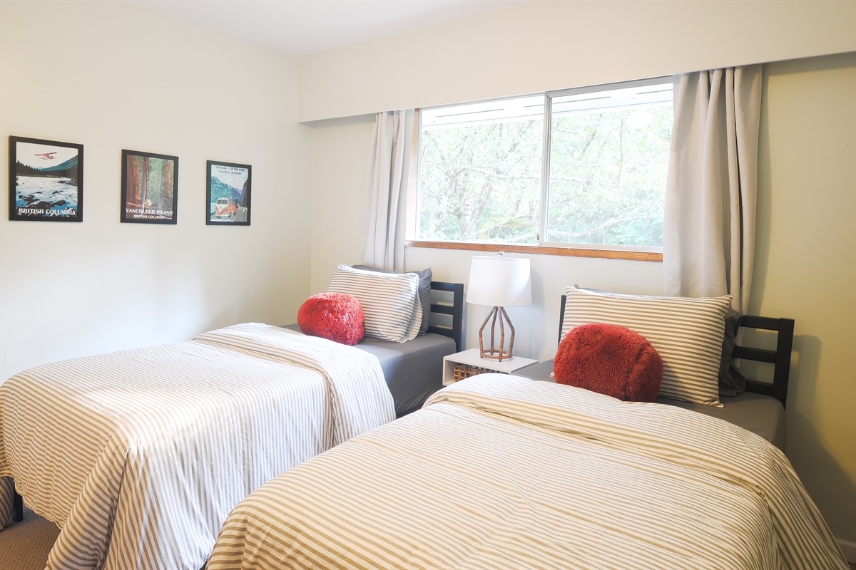 Third bedroom with two twin beds — perfect for kids