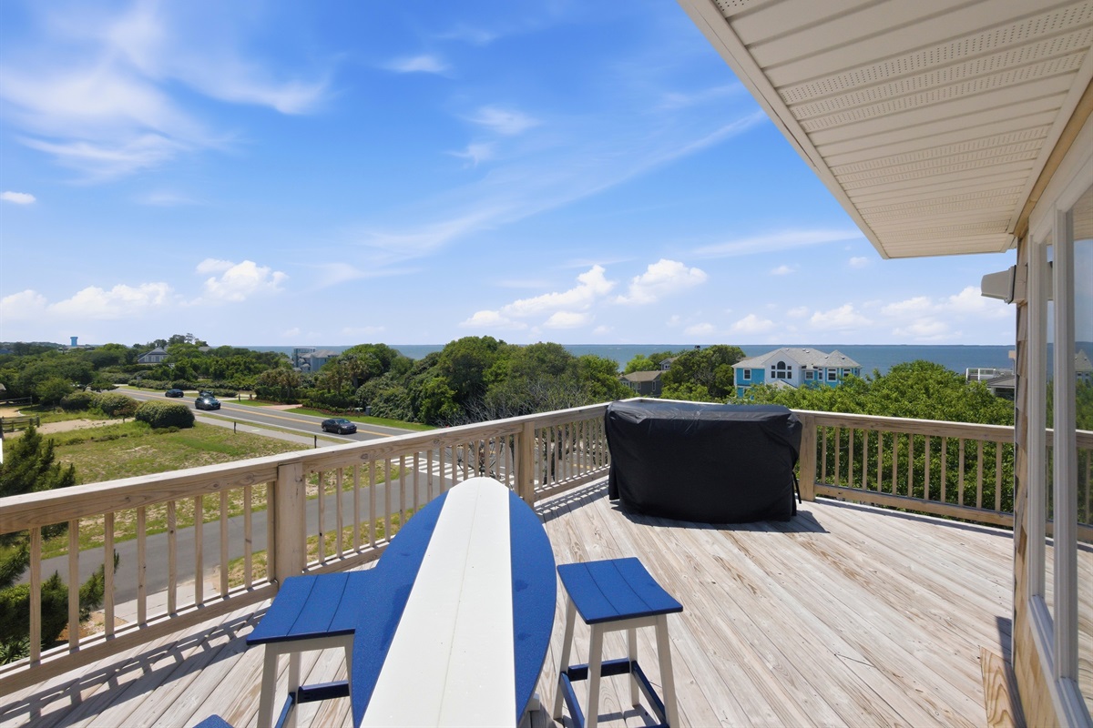 Large sun deck with elevated views of the surrounding neighborhood and sound