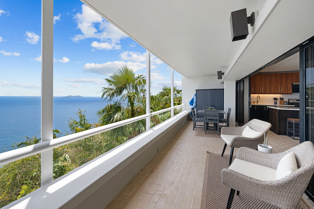 Spacious balcony with an outdoor dining table and an outdoor storage cabinet where you will find beach chairs, pool noodles, a beach cooler, and more to enjoy your stay!