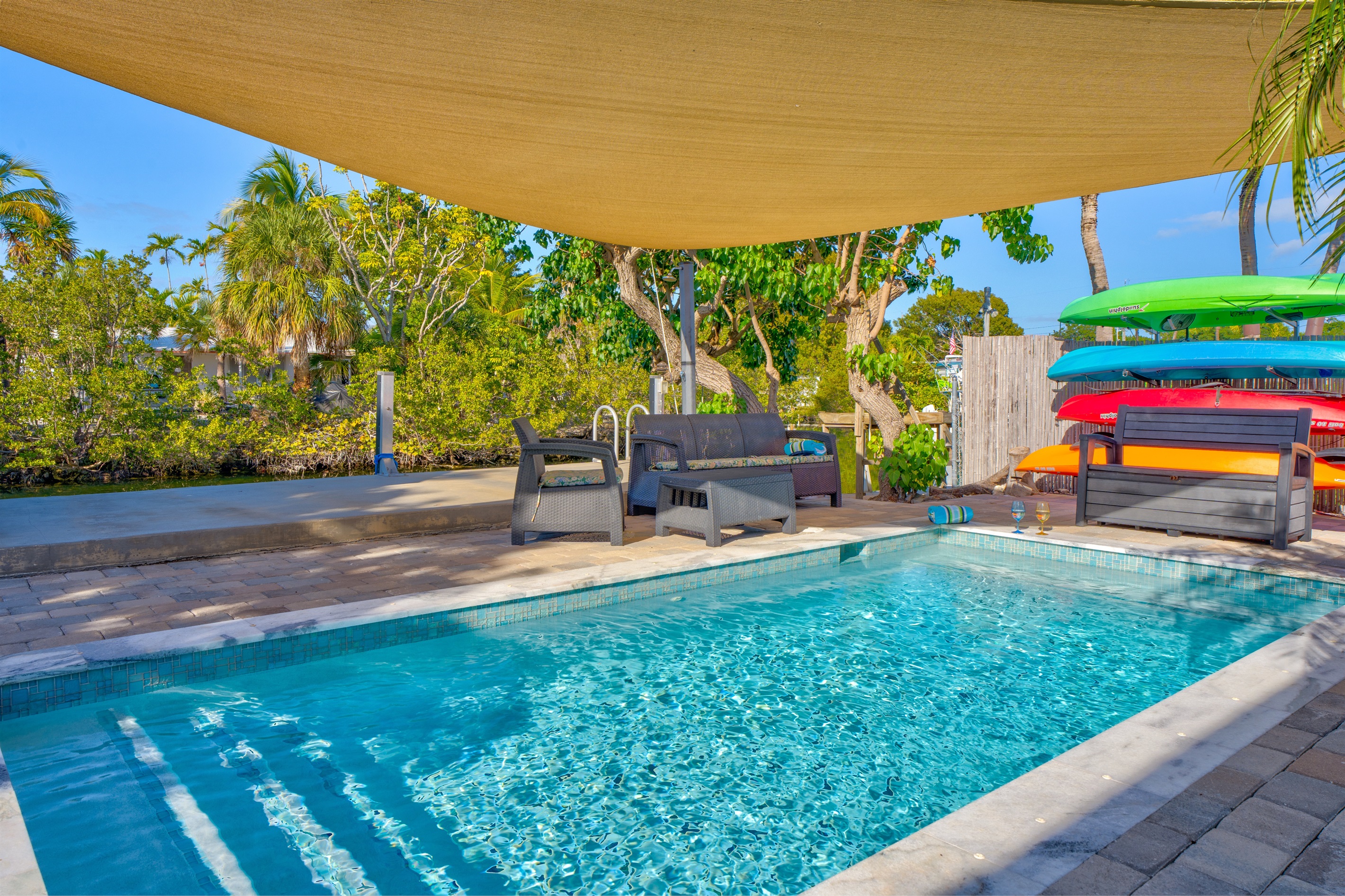 The tropical trees provide a private backyard oasis.