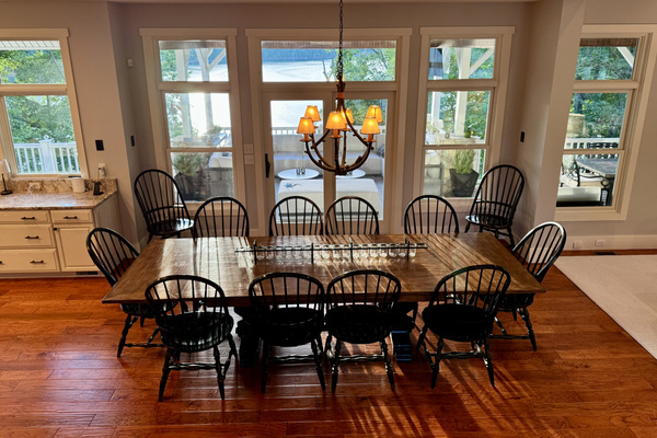 Open-concept dining connects the kitchen, great room, and spectacular views beyond