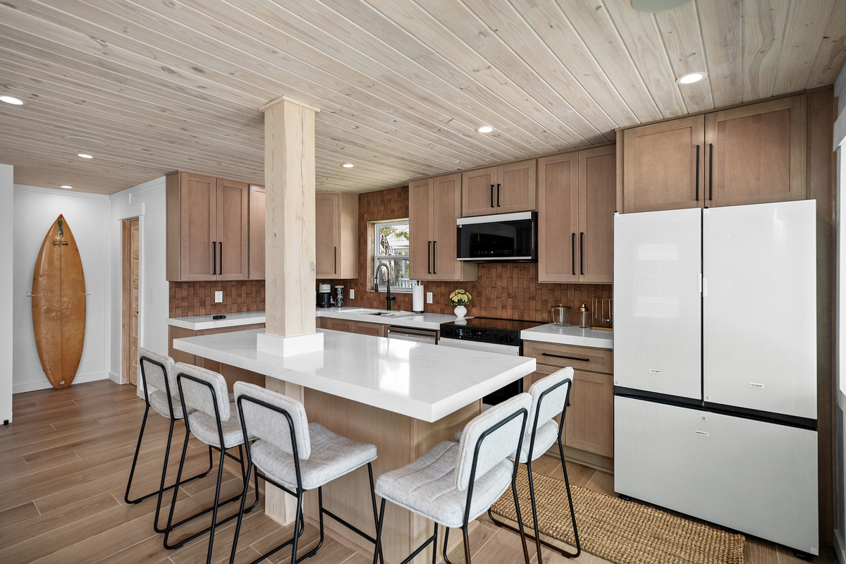Large kitchen island with seating makes breakfasts, snacks and family meals easy.