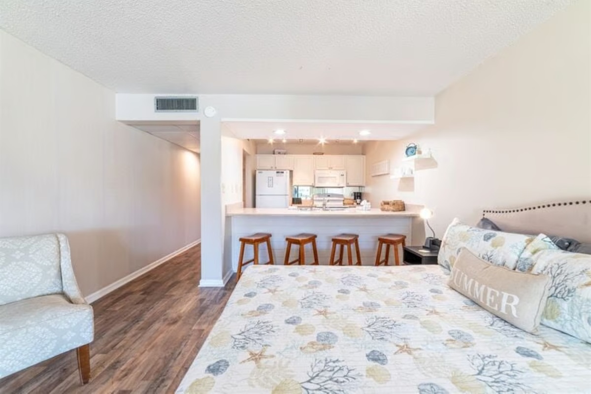 Bed + kitchen bar area
