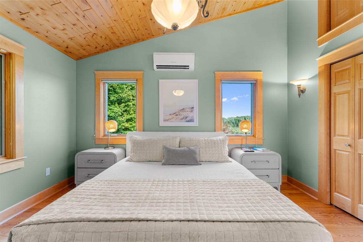Enjoy the serenity of your primary bedroom with ensuite bathroom on the 2nd level. The bedroom offers a king size memory foam mattress with the coziest of velvet quilts and plenty of pillows. 
