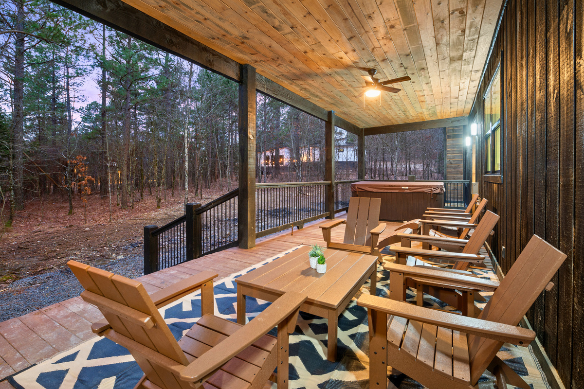 The outdoor dining area is perfect for gathering with family and friends, offering a peaceful setting in nature.