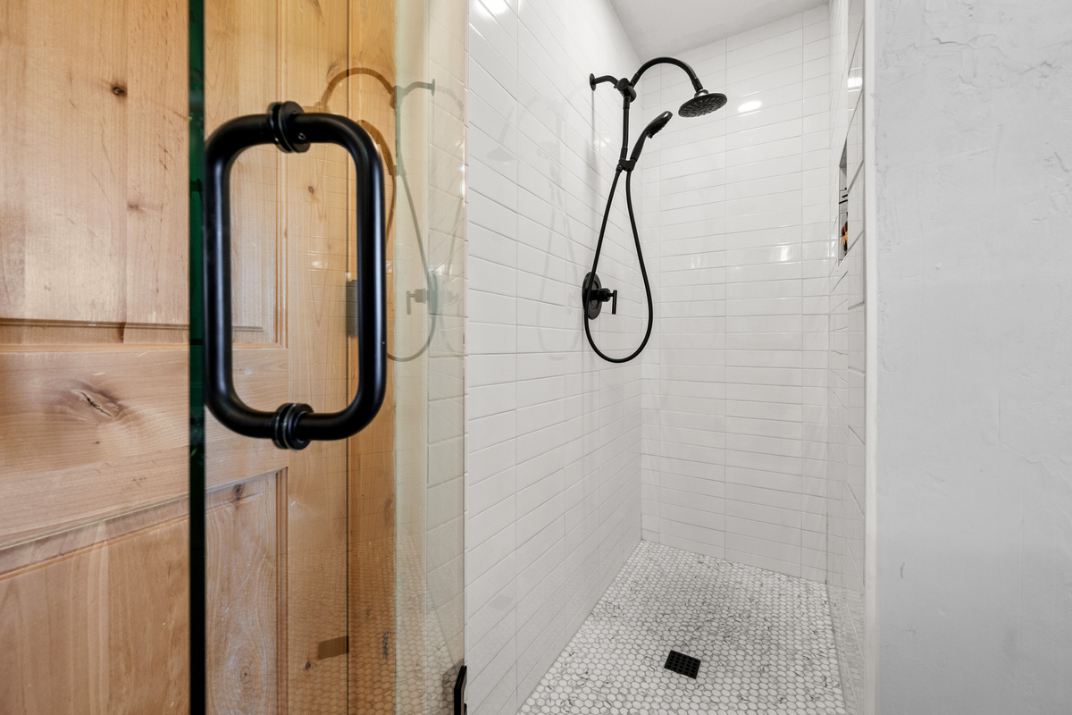 A spacious walk-in shower adds a polished, modern touch to the Jack-and-Jill bath.