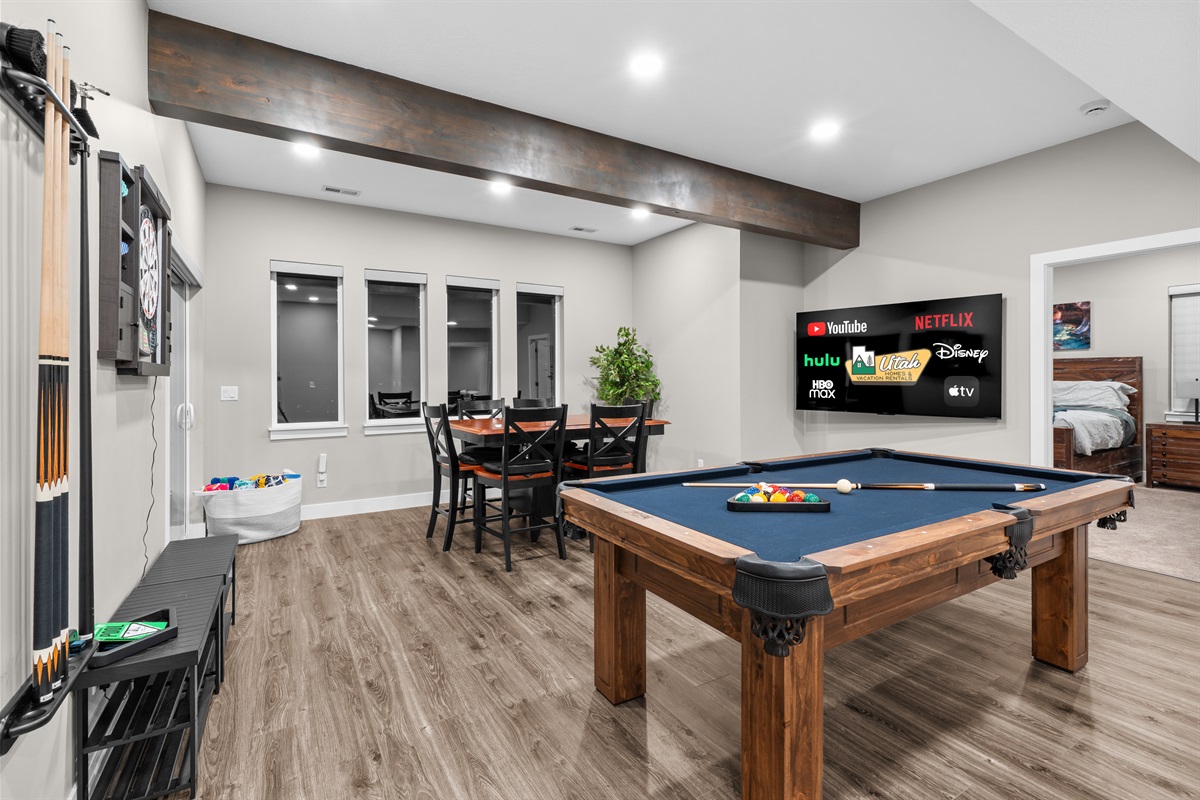 Bright and open rec room featuring multiple games and seating—designed for relaxation and fun.