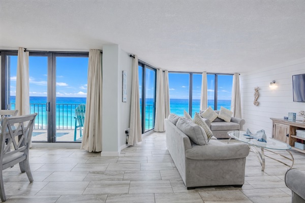 Living area with floor to ceiling view and double access to the balcony