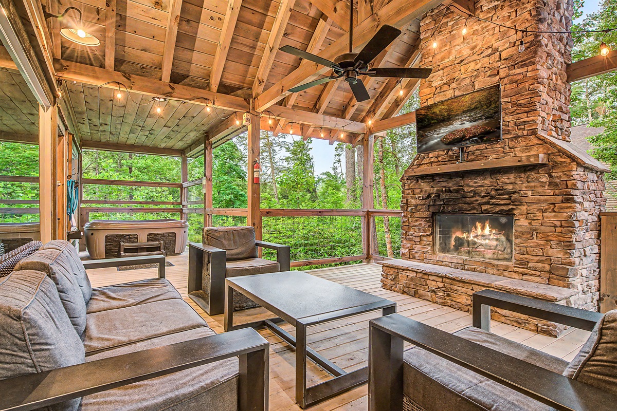 Gather around the Outdoor Wood Fireplace with Roku TV