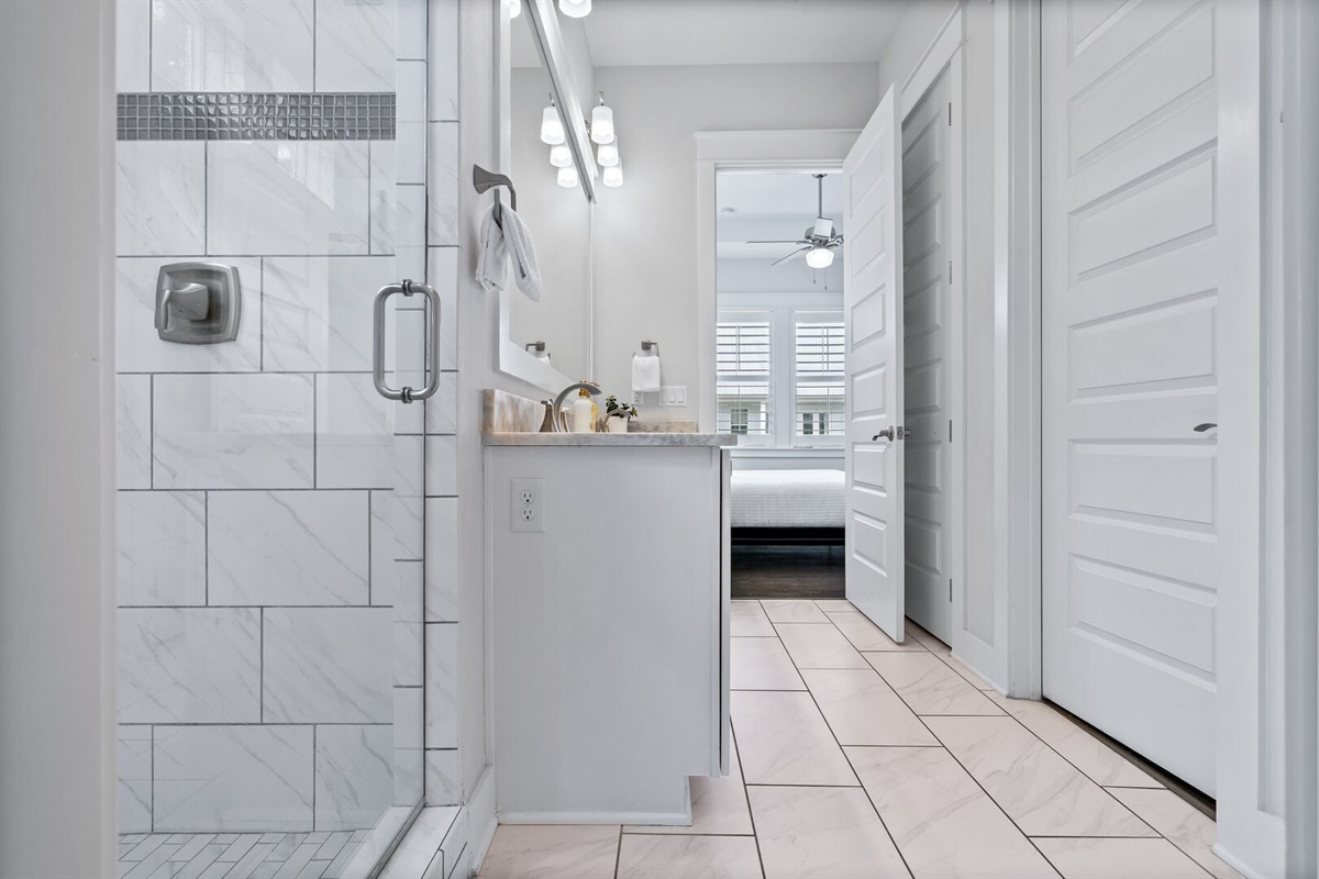 Primary bath opens directly into the bedroom.