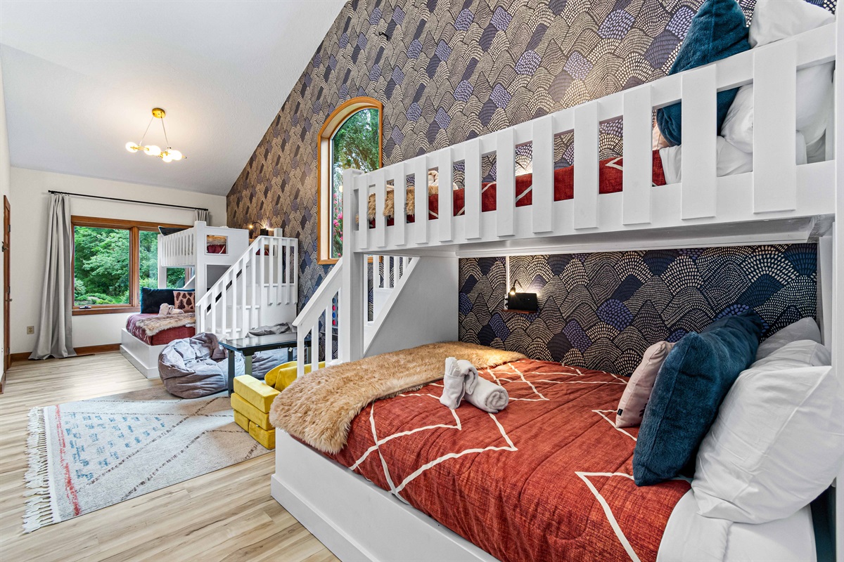 Built for fun and function—the custom bunk room sleeps plenty, with cozy bedding, playful design, and plenty of space for kids of all ages to relax together. 🛏️🎉✨