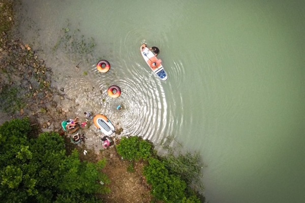Floating and relaxing in the river below the cabin (guest photo - June 2025).