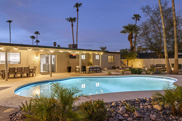 Heated pool with plenty of lounge space for relaxing in the sun
