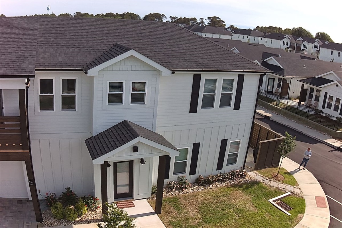 Aerial view showcasing the home and its lovely neighborhood setting