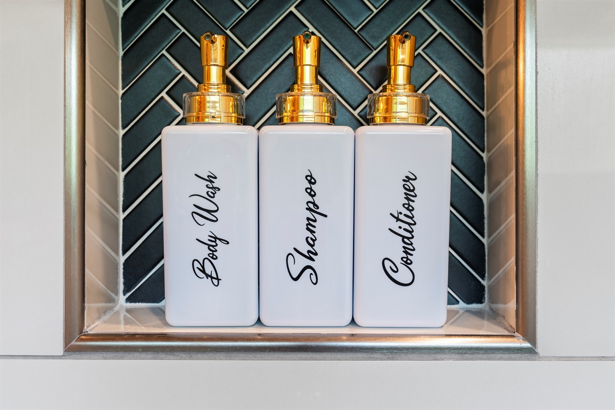 Thoughtfully stocked with luxe essentials: body wash, shampoo, and conditioner. Feel cared for with every detail.
