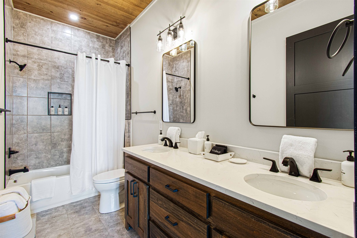 Downstairs full bathroom with a shower / tub