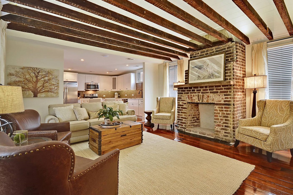 Living room featuring cathedral ceiling with original beams 