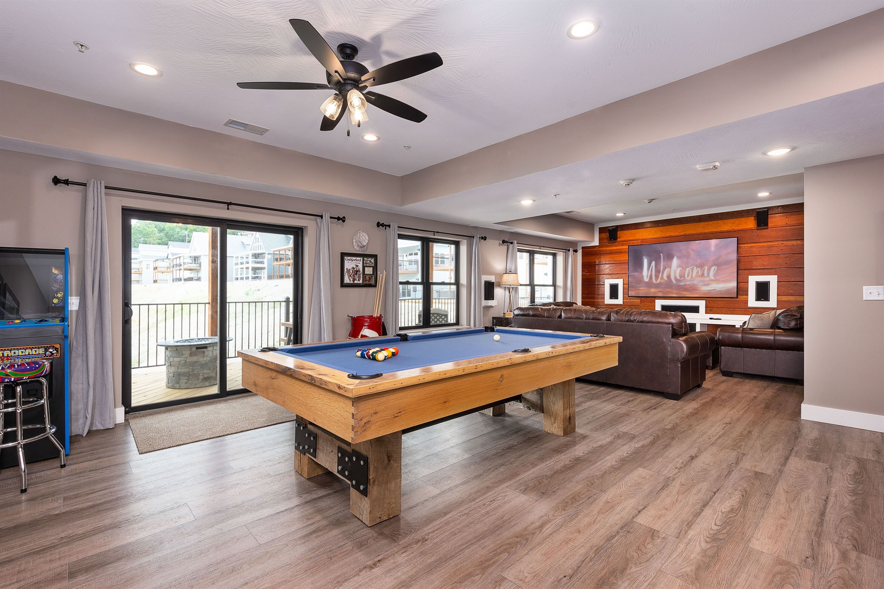 Lower Level Rec Room w/theater, custom pool table, multicade, and fridge