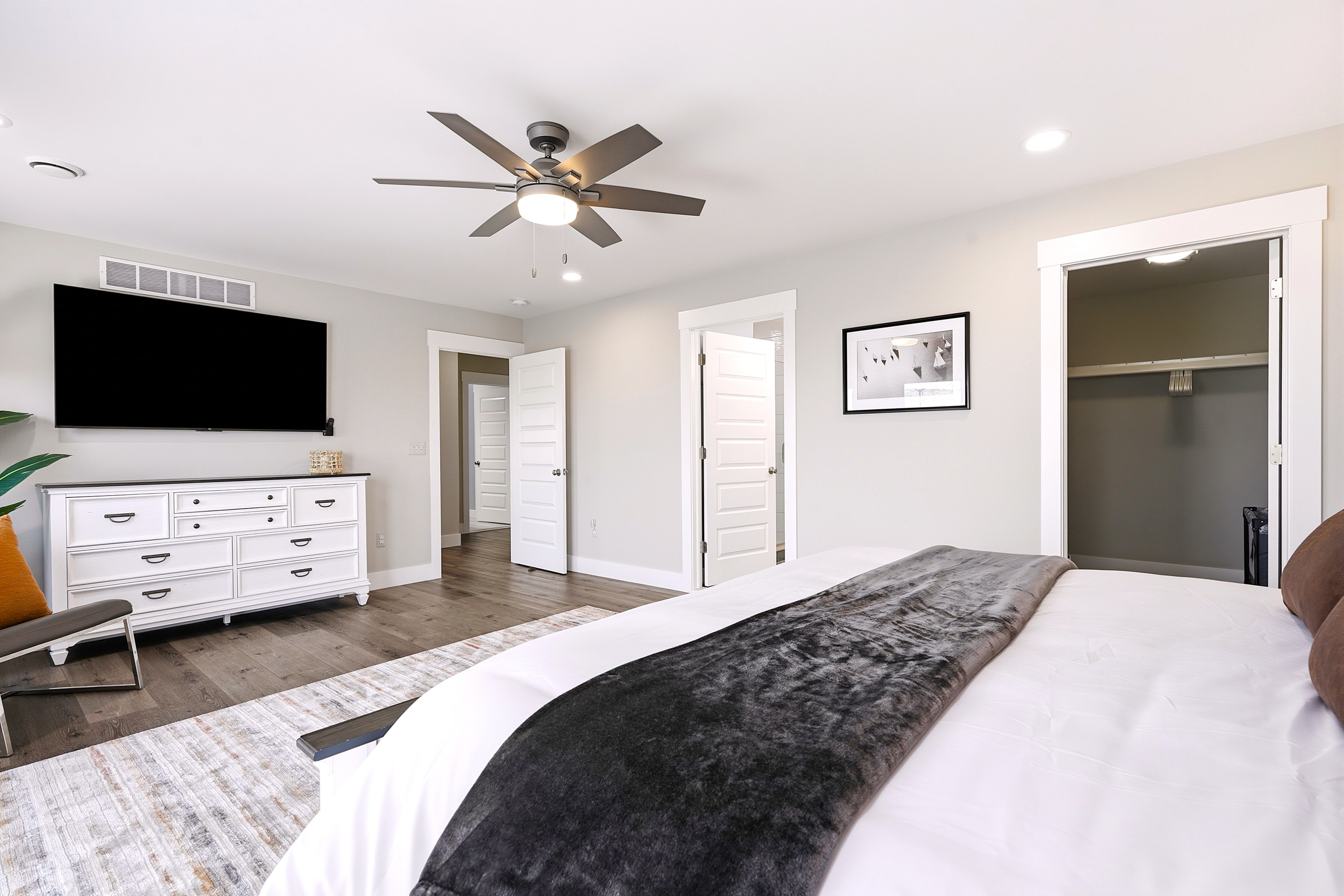 The spacious walk-in closet offers plenty of room to unpack and includes a Pack 'n Play, queen fold-away mattress, luggage rack, and hangers—perfect for families and extended stays.