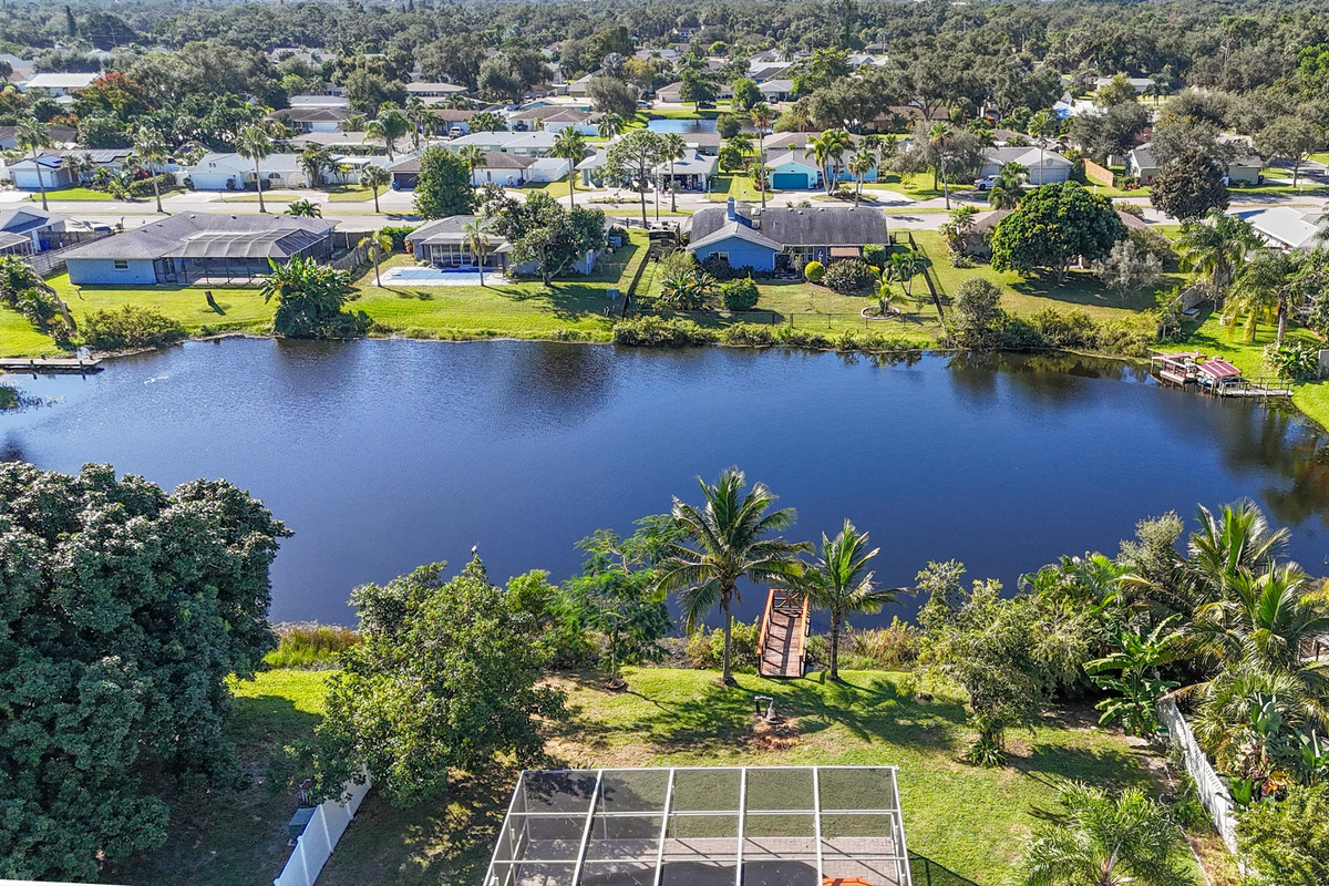 Aerial view highlights the peaceful waterfront setting and spacious outdoor surroundings.