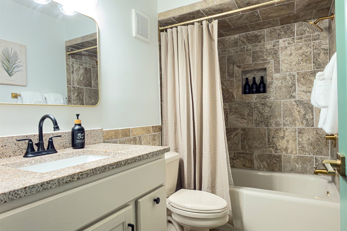 Refresh after a busy day under the brass showerhead. We provide complimentary shampoo, conditioner, and body wash to lighten your luggage. Master bathroom offers luxurious finishes such as gold hardware and brand new fixtures.