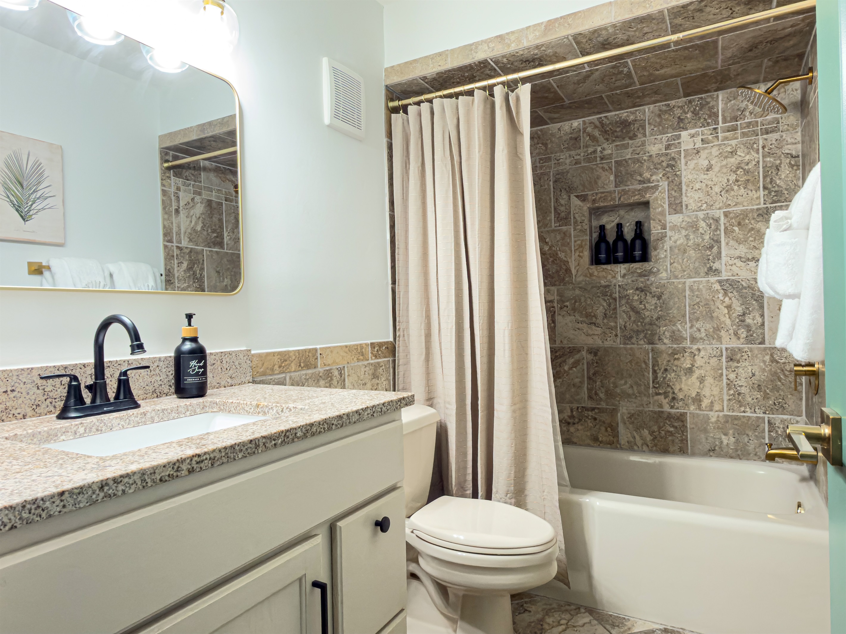 Refresh after a busy day under the brass showerhead. We provide complimentary shampoo, conditioner, and body wash to lighten your luggage. Master bathroom offers luxurious finishes such as gold hardware and brand new fixtures.
