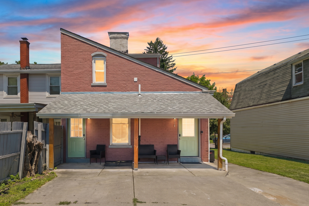 Stunning historic brick exterior glowing at golden hour; your home away from home.
