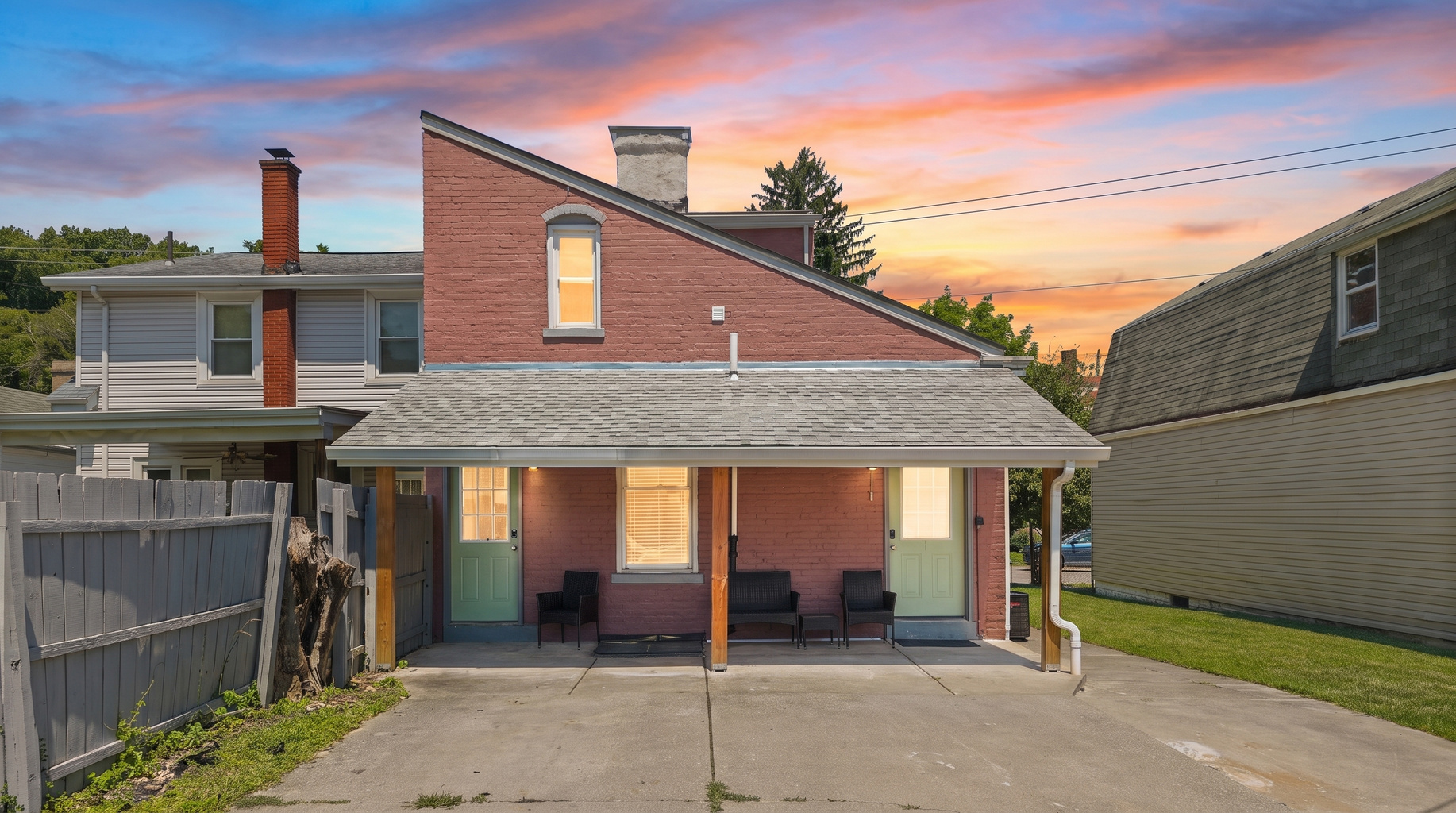 Stunning historic brick exterior glowing at golden hour; your home away from home.