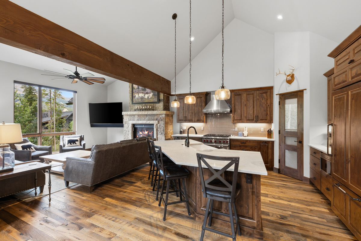 Open concept kitchen and living area so that the cook remains part of the group. 