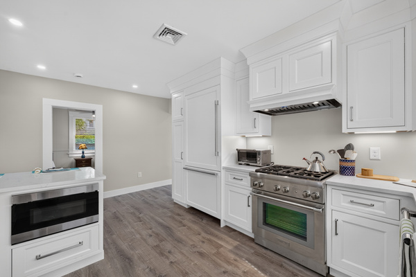 Open layout seamlessly connecting the kitchen to the living spaces for easy entertaining.