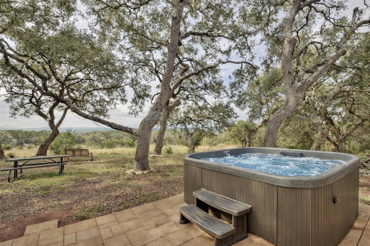 Take in sweeping hill country views while soaking in the hot tub.