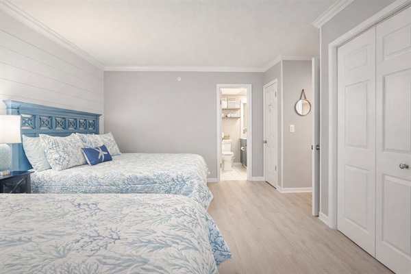 Two queen beds with a dedicated bathroom give ample space to relax