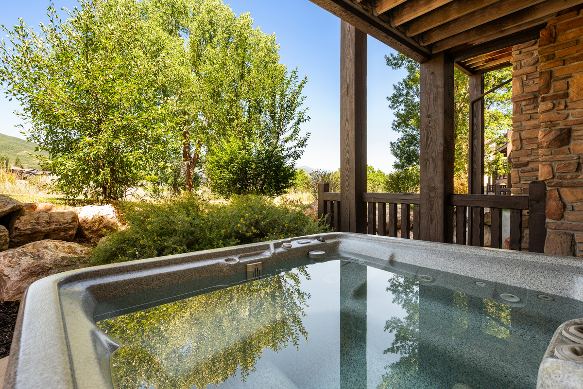 Covered hot tub offers year-round relaxation after skiing, hiking, or boating.