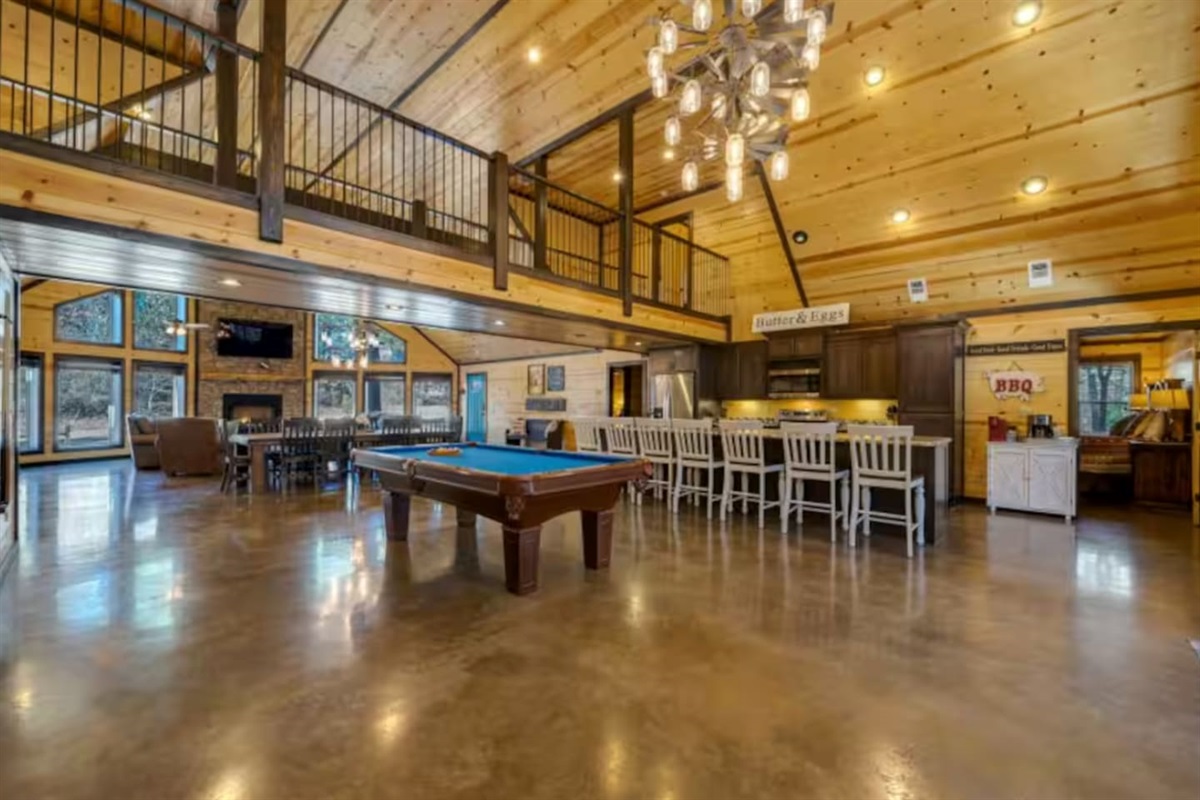Cook, dine, and play—this open-concept hub brings everyone together for meals, laughs, and a little friendly competition.