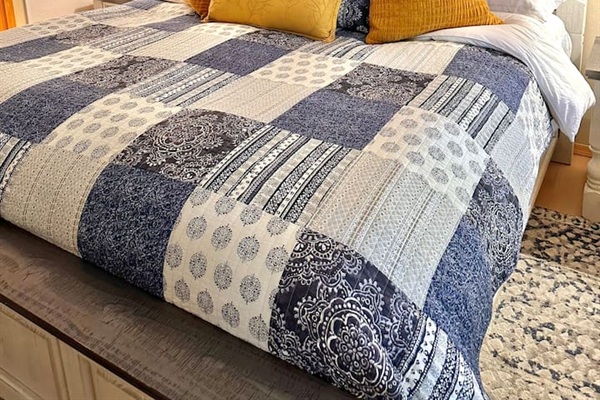 King bed in the master bedroom has a high quality mattress, linens and pillows. Sleep just like you would from the comfort of your own home!