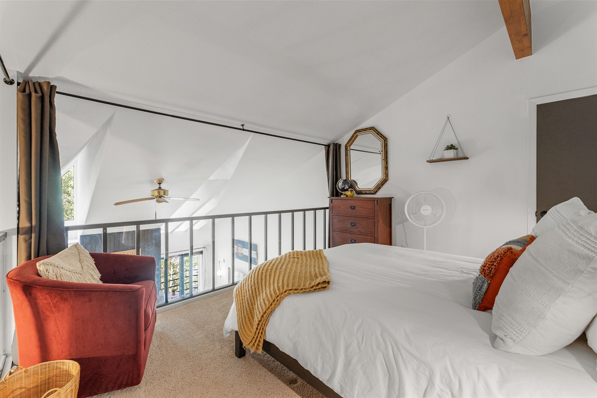 Loft with queen bed and curtains for light and privacy
