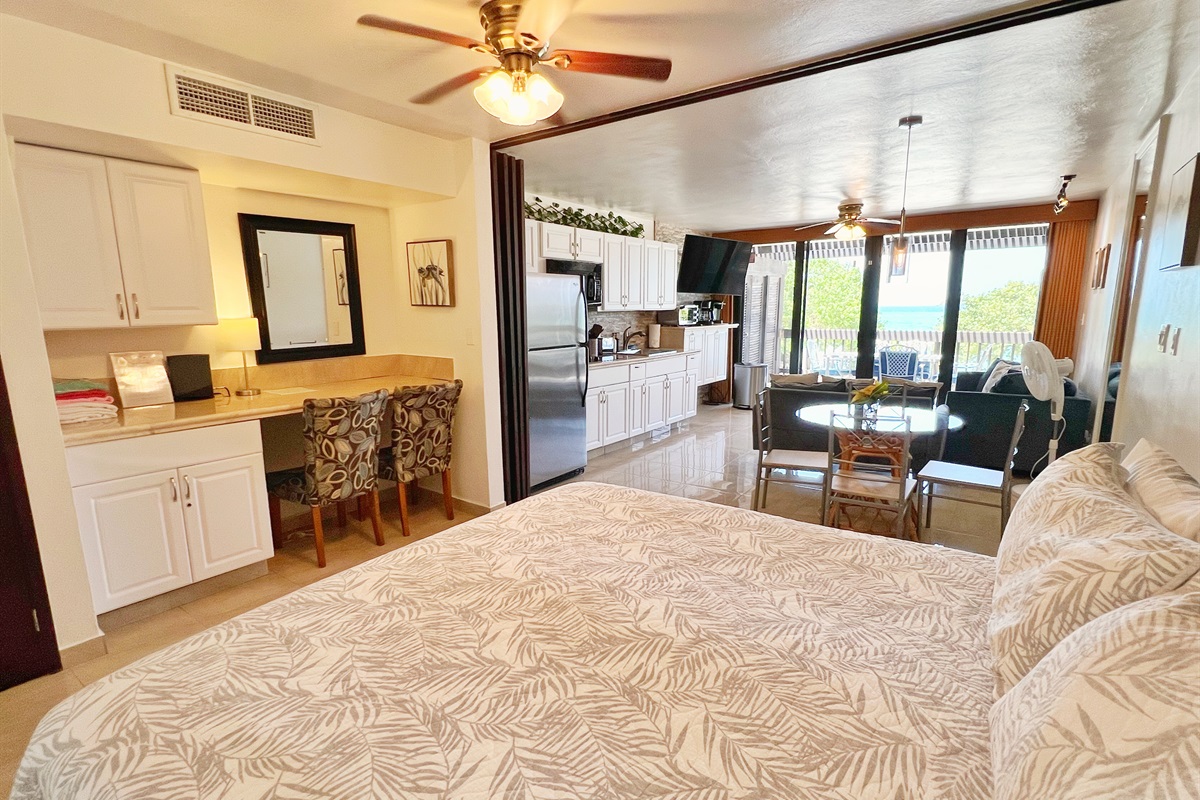 King bed with desk and storage in bedroom