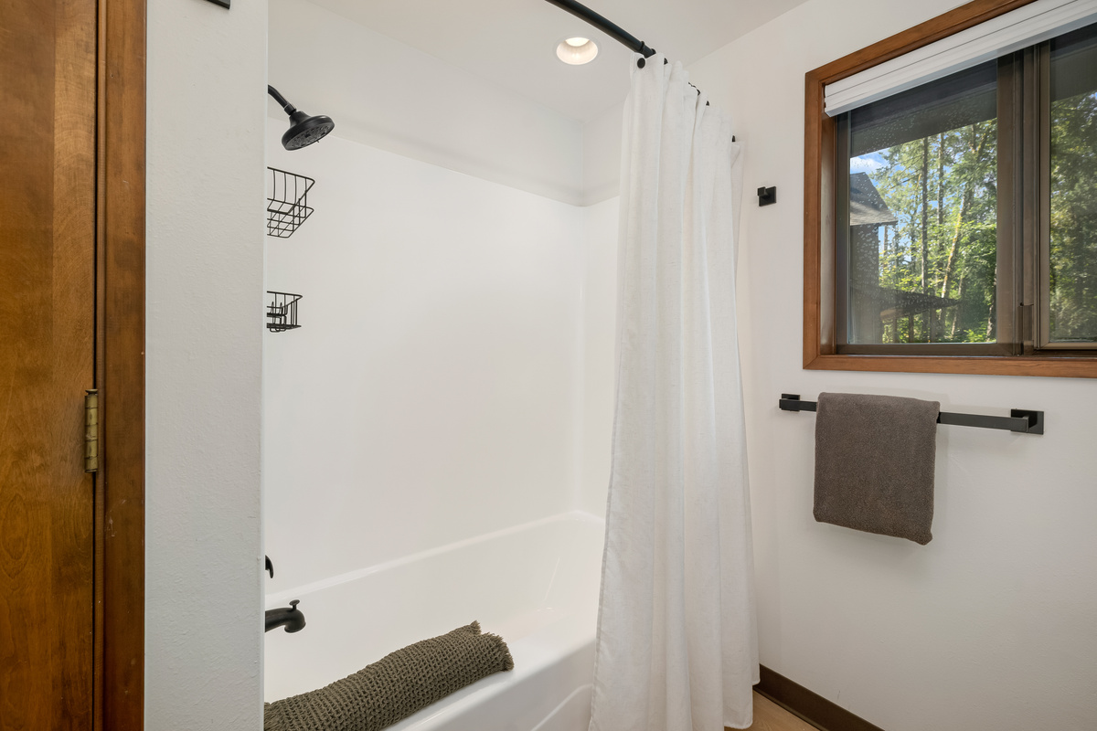 Soak away the day with treetop views right from the tub.