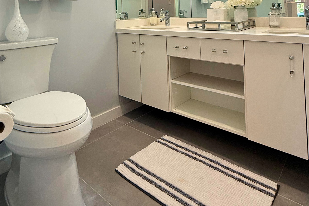 A gorgeous and well appointed bathroom on the lower level