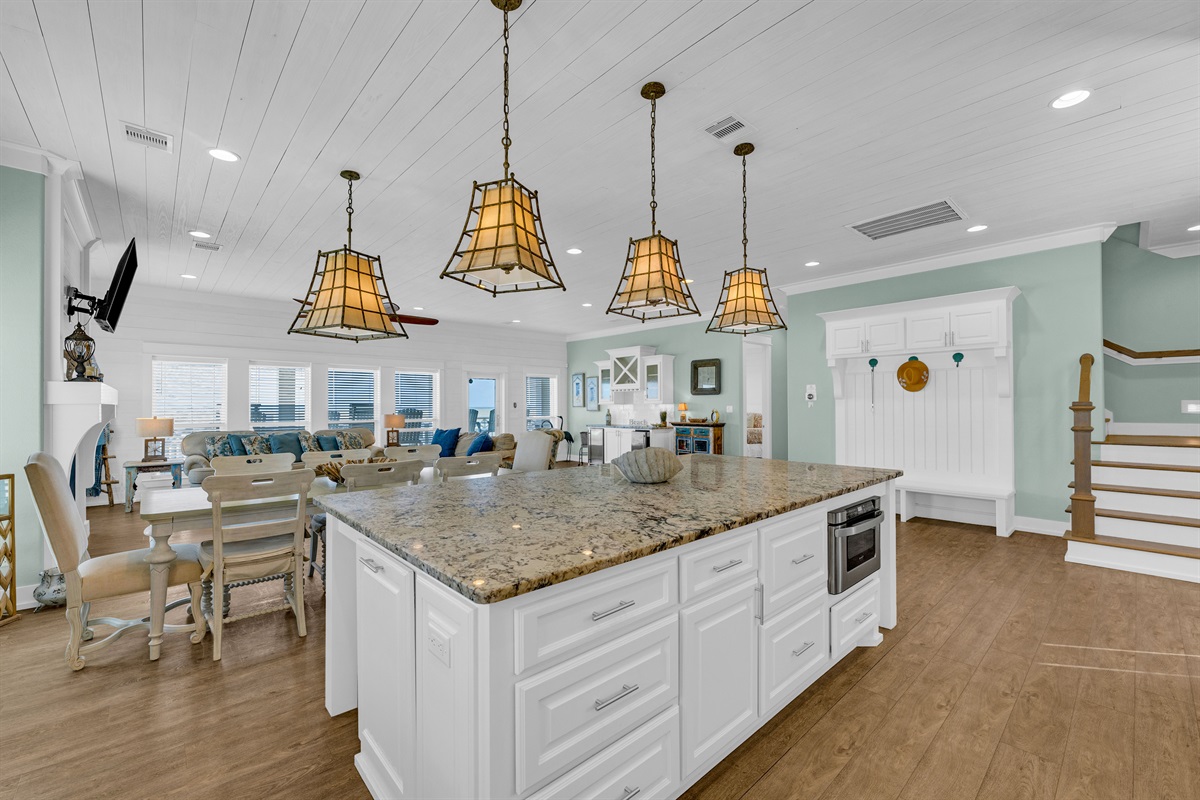 Sea It All: Embrace seaside living in this impeccably designed kitchen, highlighted by oversized windows that flood the room with natural light.