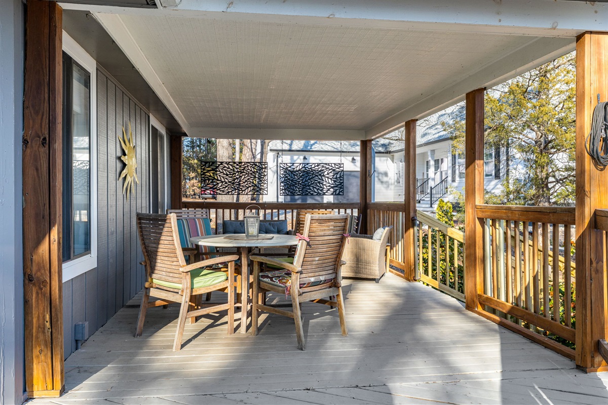 Porch: Unwind in style on this spacious deck with vibrant seating and lovely views!
