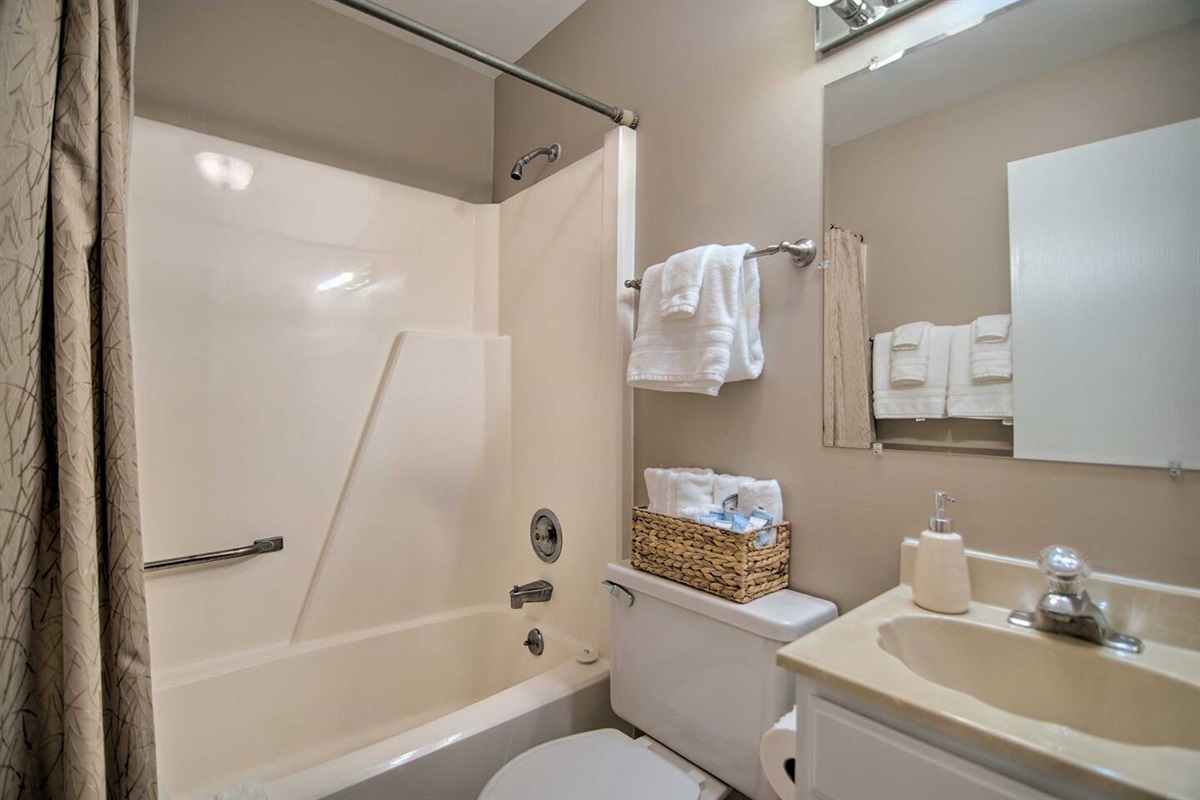 There is a second full bath upstairs with a combination bathtub and shower that serves the second and third upstairs bedrooms as well as the workstation. 