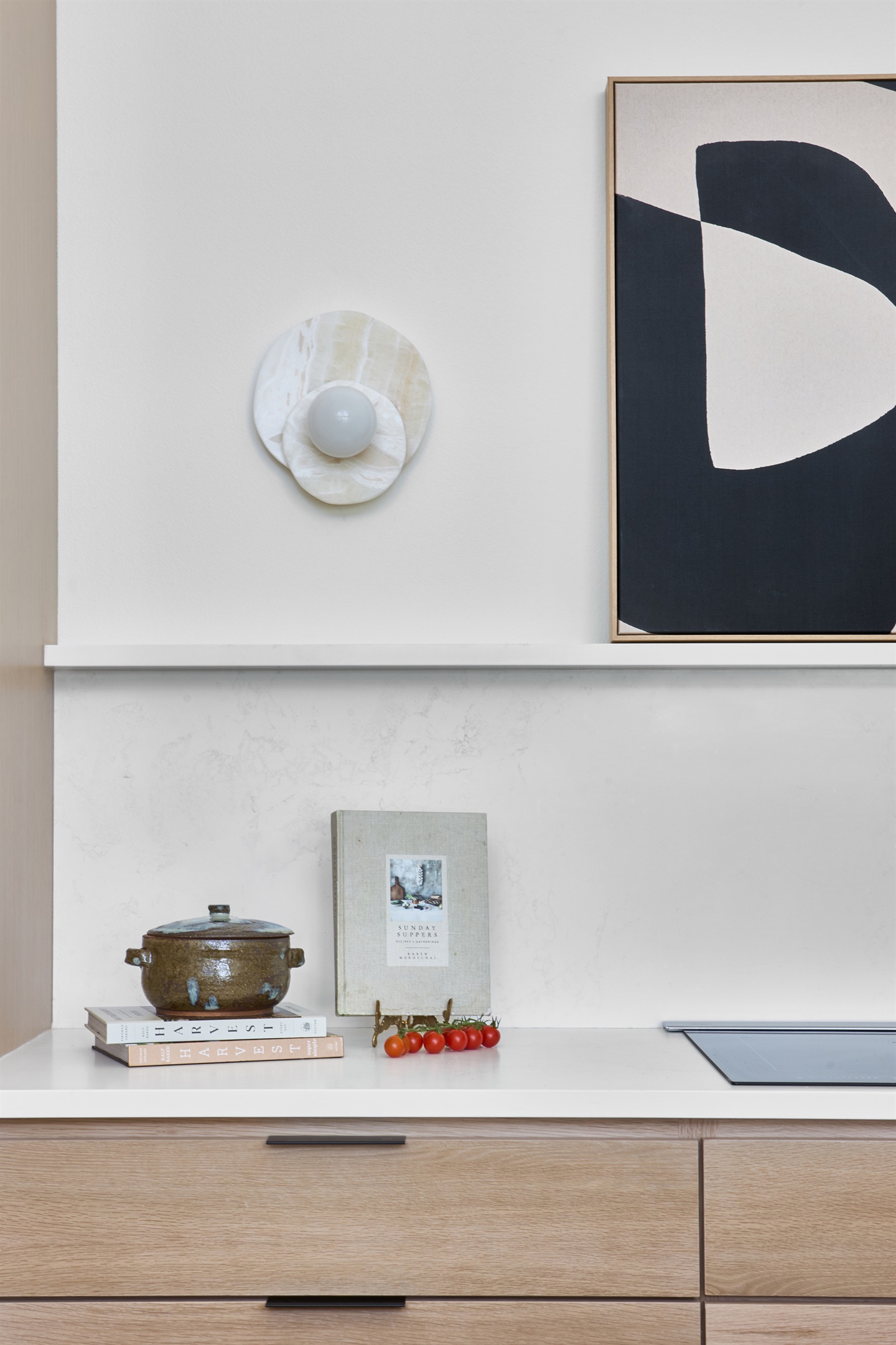 Modern art and natural textures add warmth and personality to this chef’s kitchen.