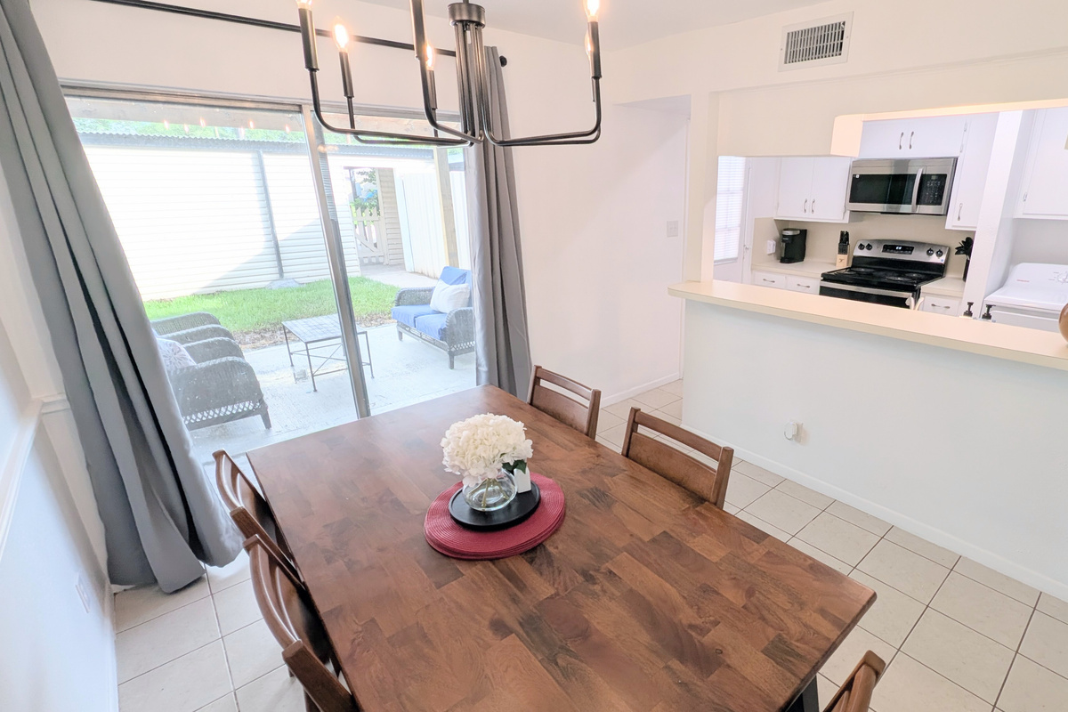 Dining room also has convenient access to the outdoor courtyard and galley kitchen.